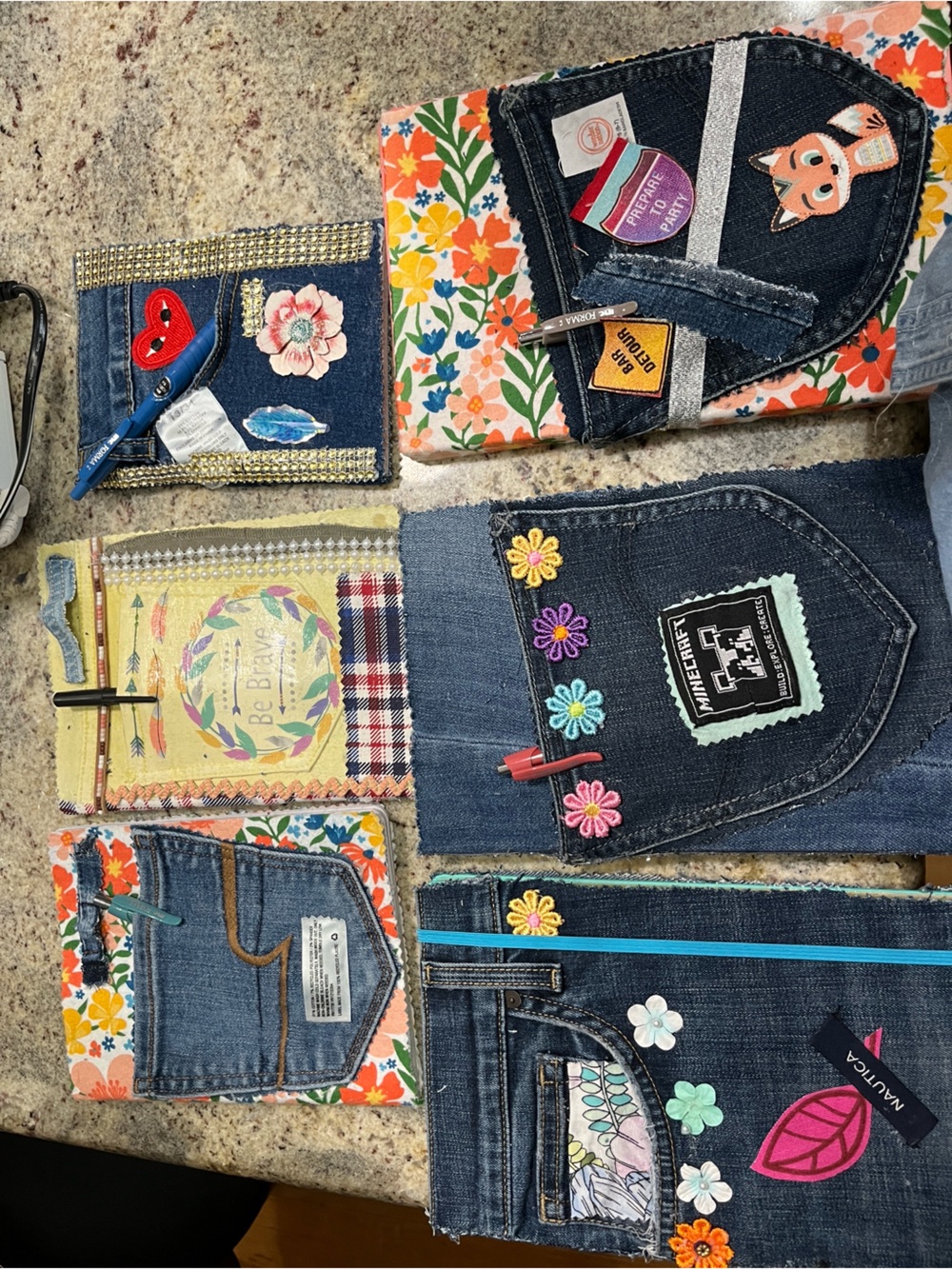 Colorful Denim Journals. Pictured front and back. Yep, some people still write.